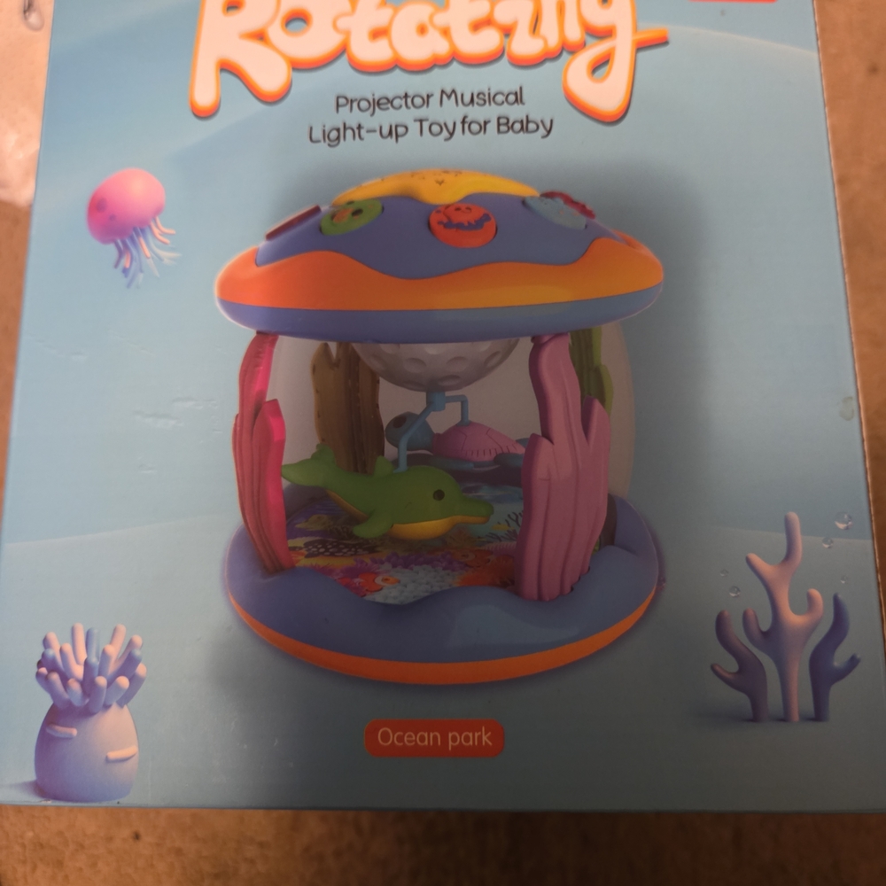 Ocean Park Rotating Projector Musical Light-Up Toy - Pink & Blue